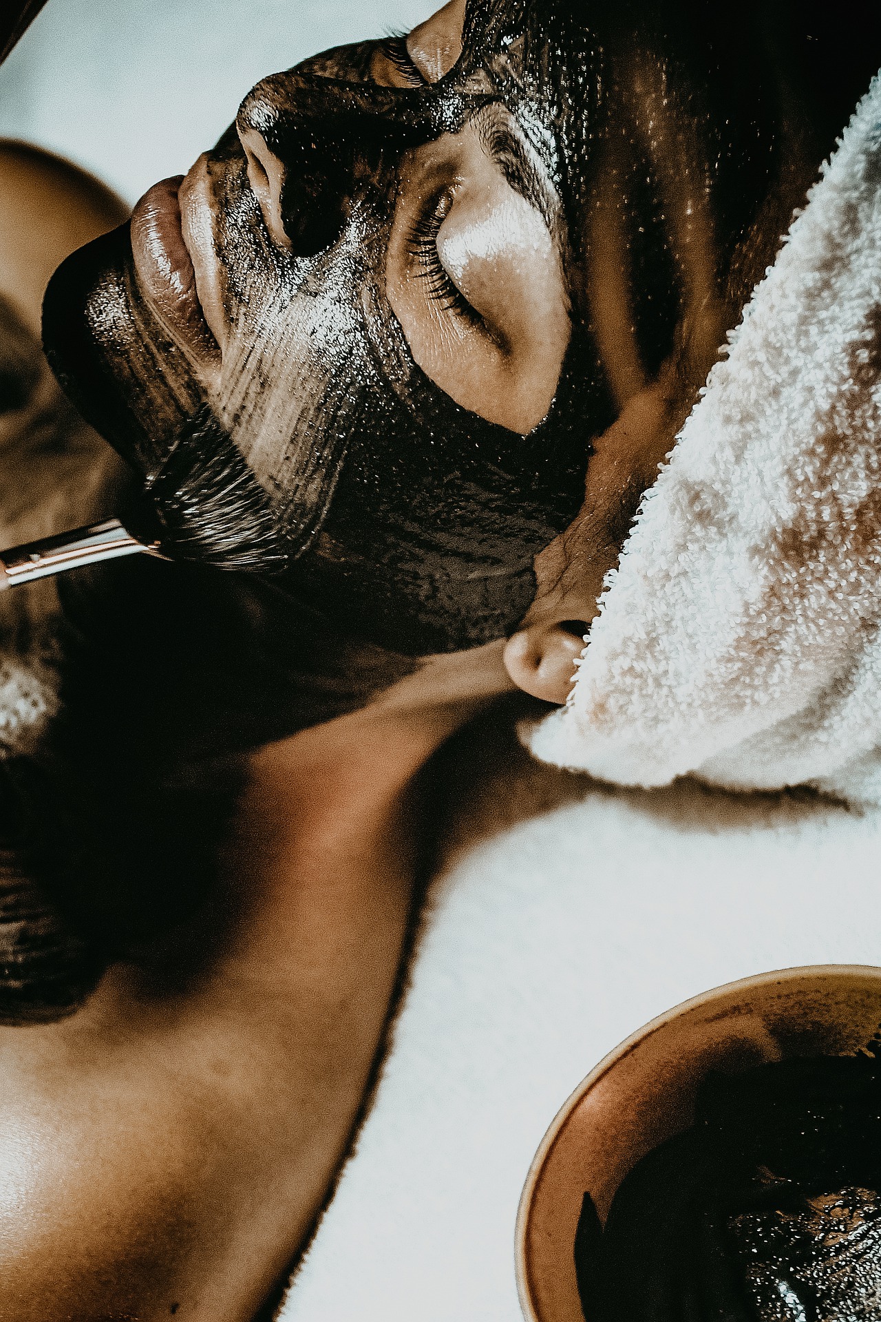 a woman getting a facial treatment